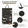 Black felt earring organizer display with various jewelry items and a thick rope for hanging
