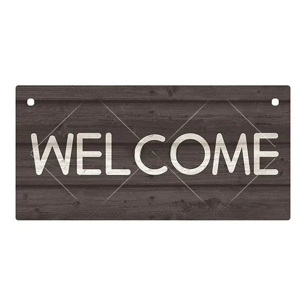 A dark wooden sign with the word WELCOME carved or painted in white letters.