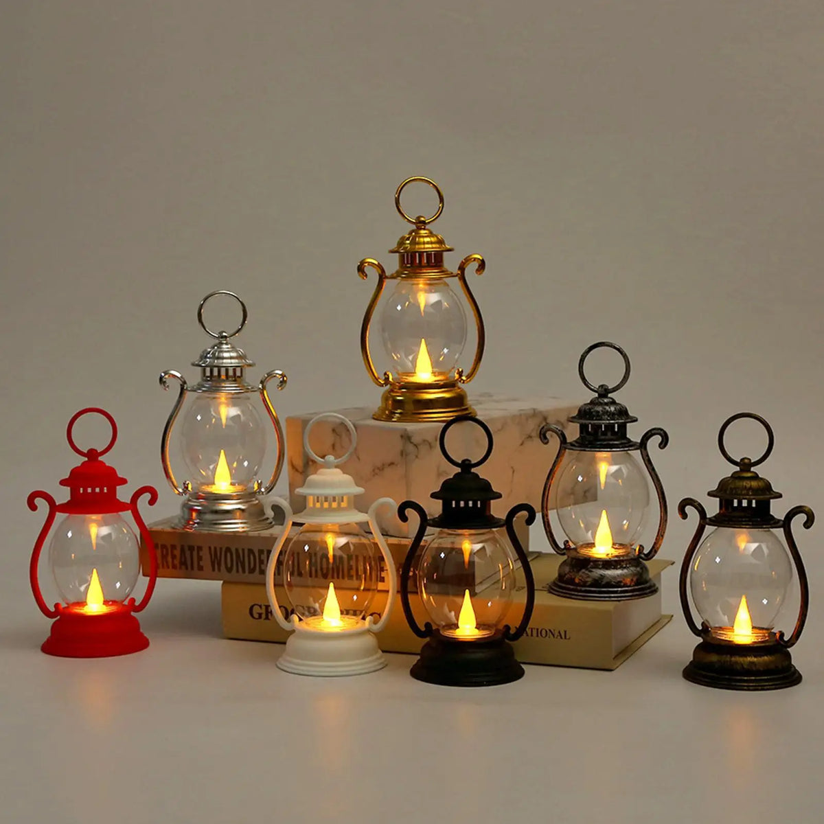 A collection of vintage-style battery-powered desk lamps in various sizes and finishes on a white surface.