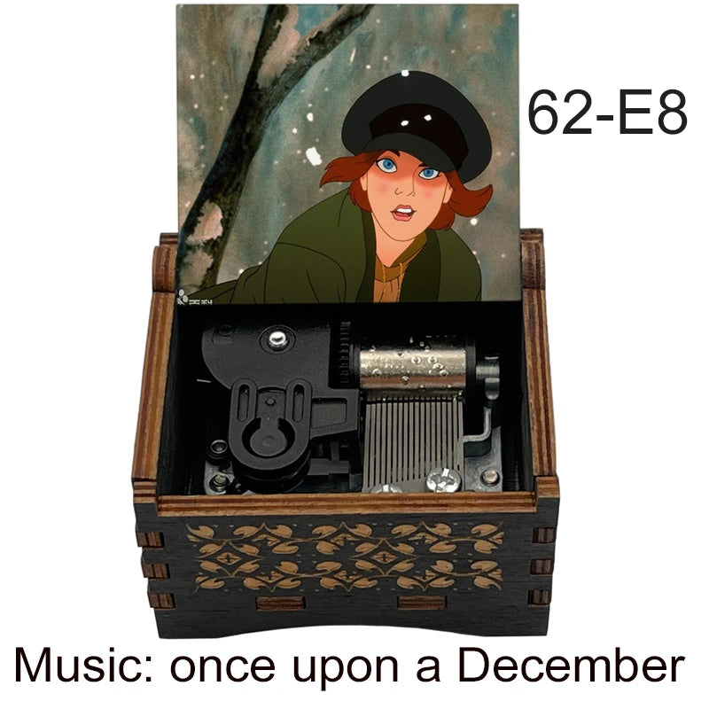 A hand-cranked wooden music box featuring a woman, with the title Music: once upon a December visible on the packaging.