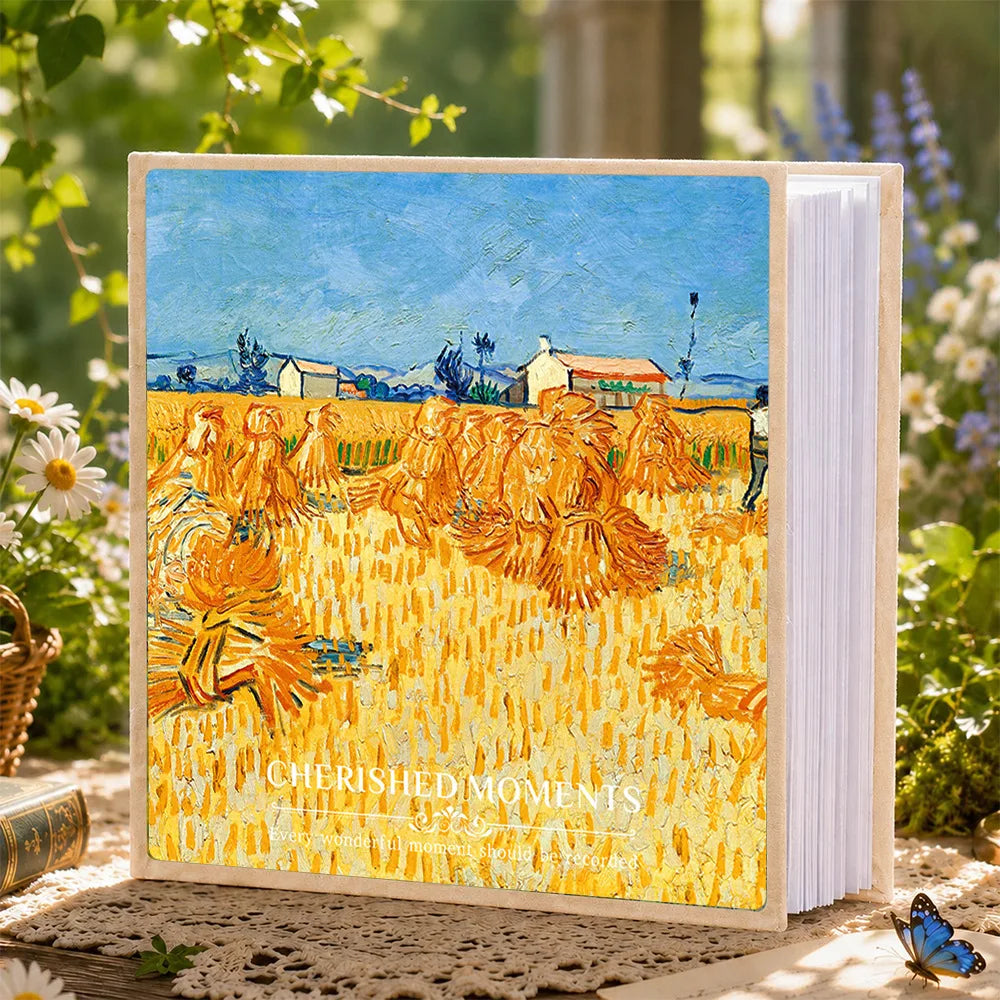 A 6-inch laminated photo album featuring a painting of golden wheat fields under a blue sky.