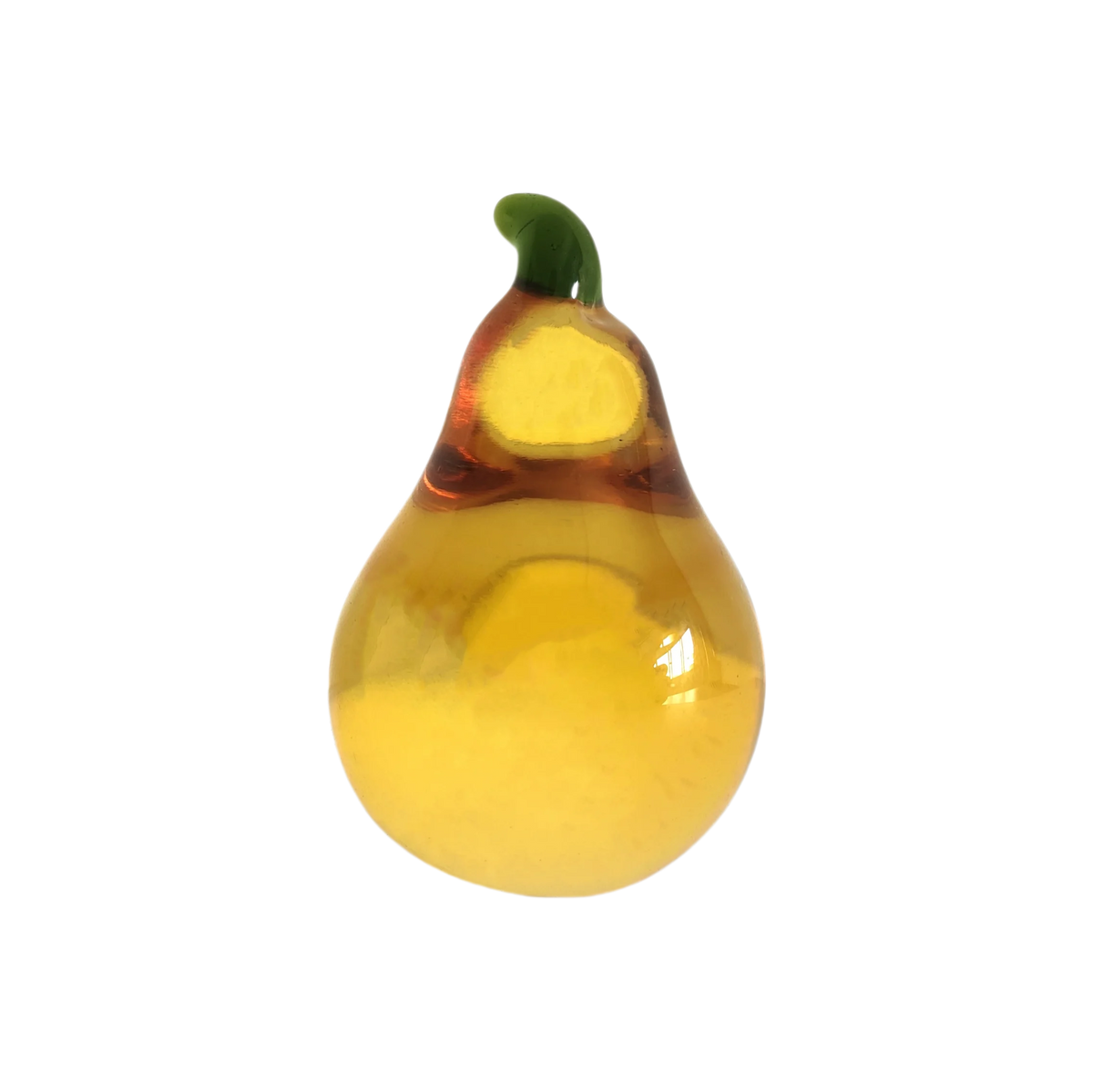 A yellow crystal glass figurine shaped like a pear with a green stem.
