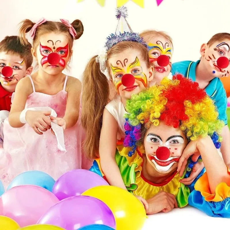 A group of children wearing classic red clown noses and colorful makeup for a costume party.