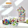 Colorful faceted crystal whiskey glasses with a unique geometric design displayed on a white surface.