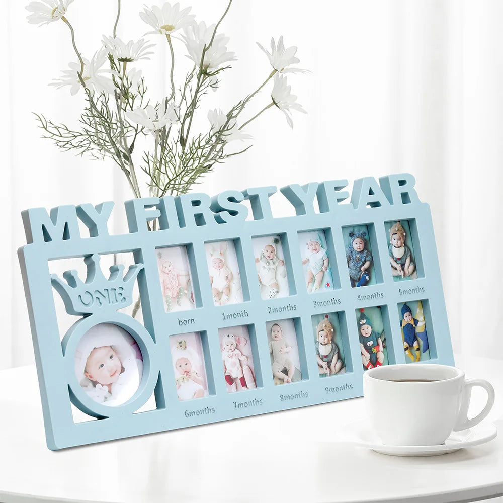 A wooden photo frame display showing monthly growth photos for a baby's first year