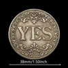 Antique silver-gray decision coin with a floral design surrounded by an ornate border.