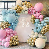 A balloon garland arch featuring pastel pink, blue, and gold balloons for a party decoration.