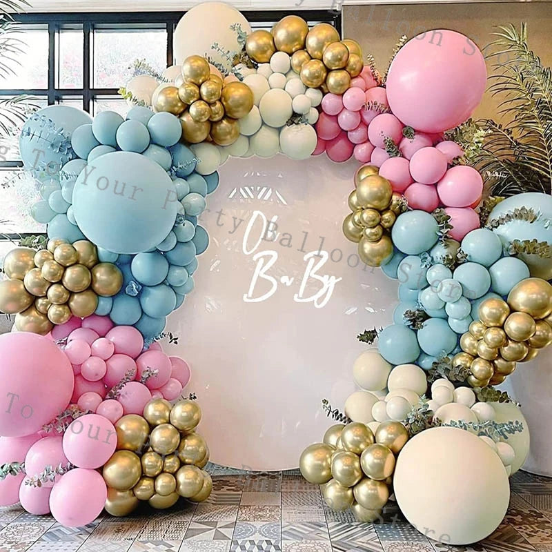 A balloon garland arch featuring pastel pink, blue, and gold balloons for a party decoration.