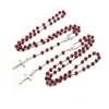A set of beaded crucifix necklaces featuring red beads and silver accents.