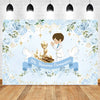 A light blue floral backdrop featuring a boy in a white shirt celebrating his first communion.