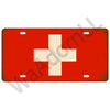 A vintage red metal tin sign featuring a white Swiss cross symbol.