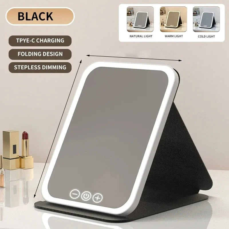 A black USB rechargeable vanity mirror with a folding design and stepless dimming feature is displayed on a stand.