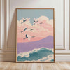 A framed canvas print depicting a flock of white cranes flying against a soft pink and purple sunset sky.