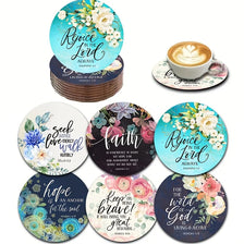 A set of six wooden bible verse coasters featuring floral designs and inspirational scripture