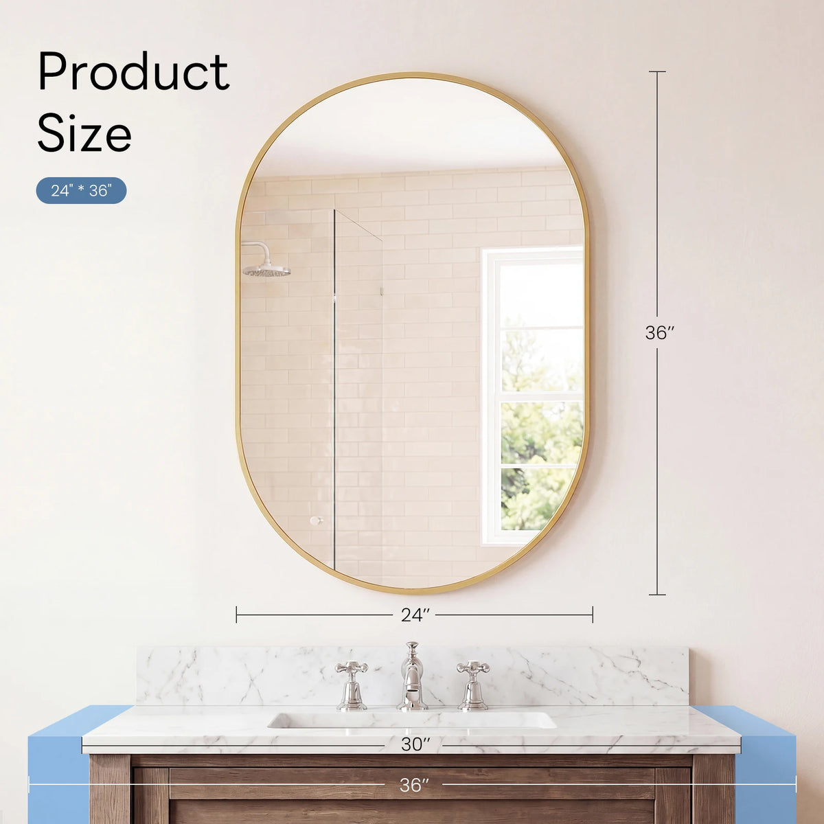 Oval wall mirror with a gold metal frame hanging above a marble vanity countertop.