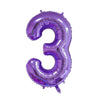 A purple foil number balloon shaped like the number three.