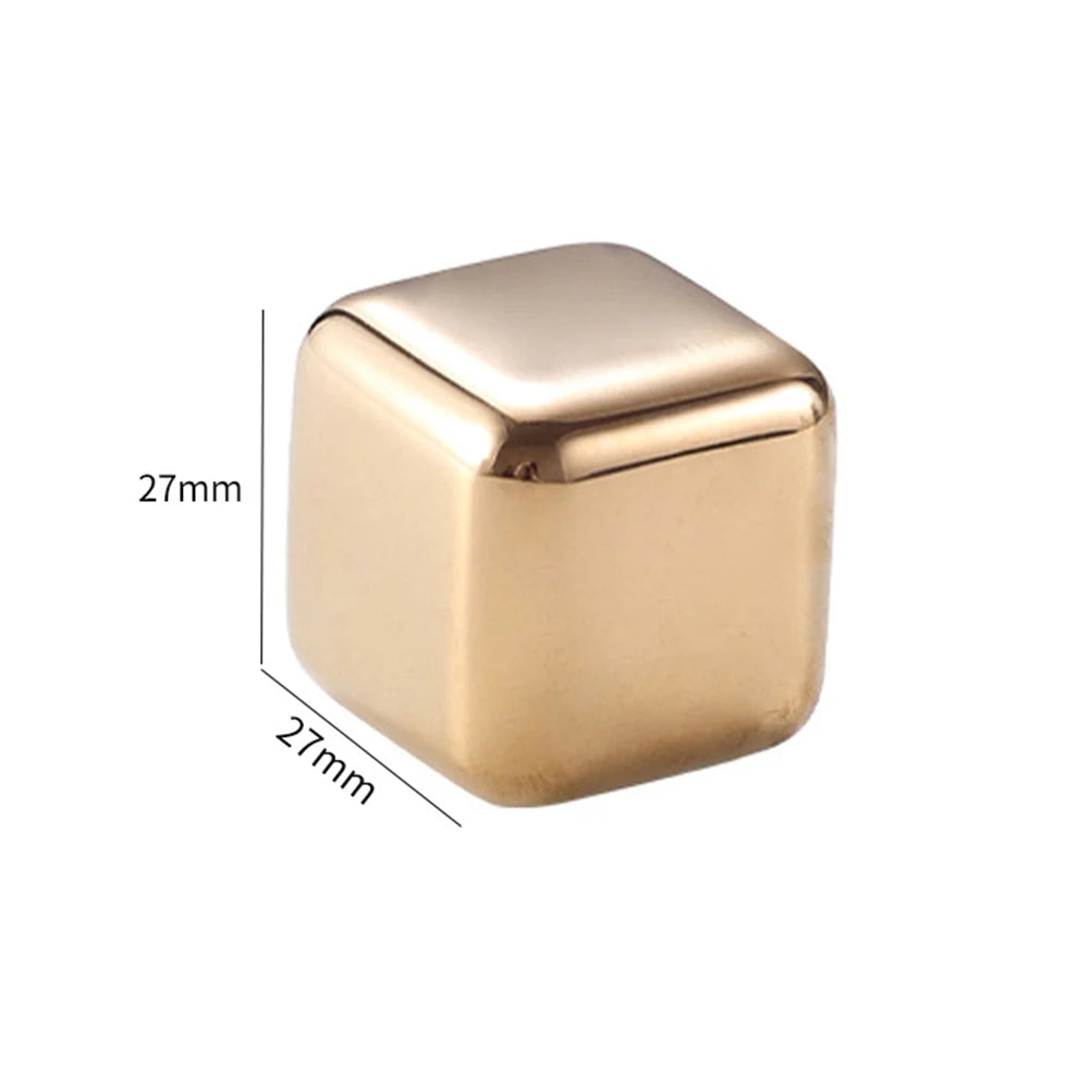 A square, polished gold-toned stainless steel ice cube with dimensions of 27mm on each side.