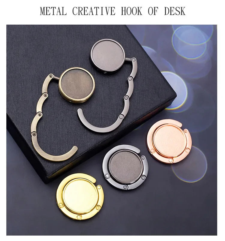A set of metal creative hooks of various sizes and finishes displayed on a dark surface.