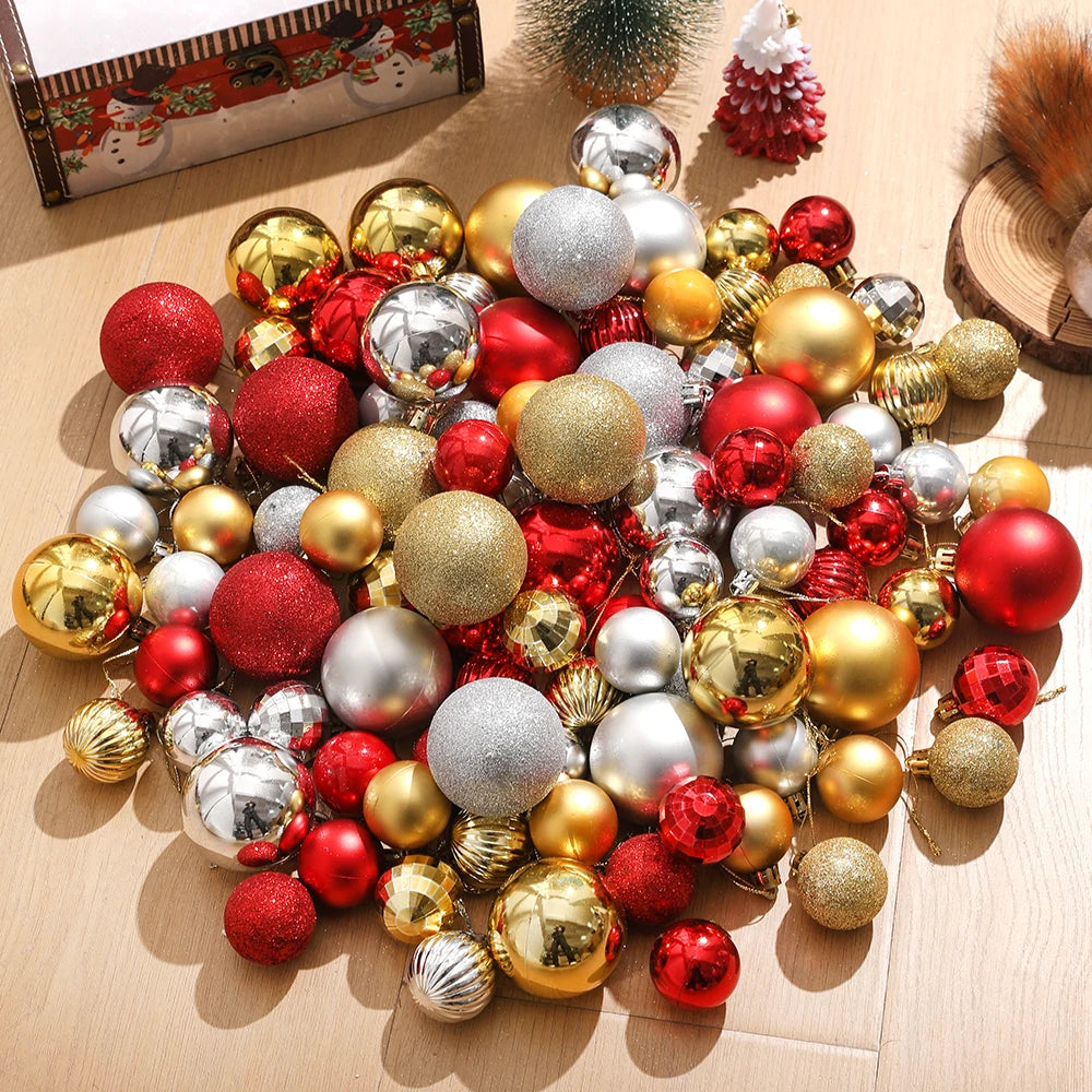 Assorted Christmas tree ornaments and baubles in various colors including gold silver and red