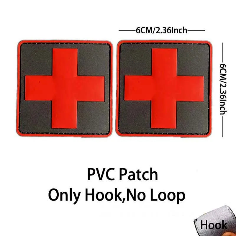 A pair of red cross patches with black backgrounds, designed as a hook for tactical or morale use.