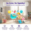 A set of colorful squishy squeeze stress relief sensory toys including a clear blue ice cube and a pink star.