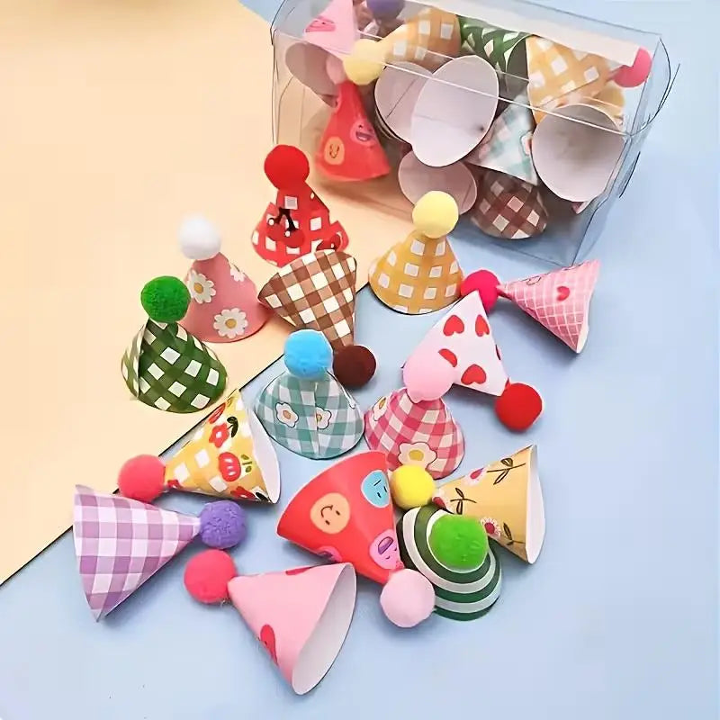 A collection of mini colorful party hat cake toppers in various patterns and colors arranged in a clear plastic container.