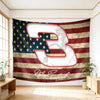 A large banner featuring the number 3 and American flag stripes in distressed tones, signed by Dale Earnhardt Sr.