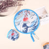 A blue fabric hand fan featuring a Japanese wave design and cherry blossoms, shown with a hanging chain.