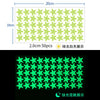 A grid of 50 light green stars and a grid of 50 bright green stars, demonstrating glow-in-the-dark features.