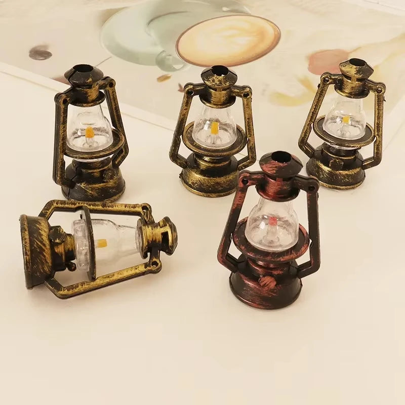 A collection of vintage ceramic miniature lanterns for dollhouse décor, featuring brass and dark colored metalwork.