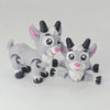 A gray and white 3D printed goat figurine with movable joints.