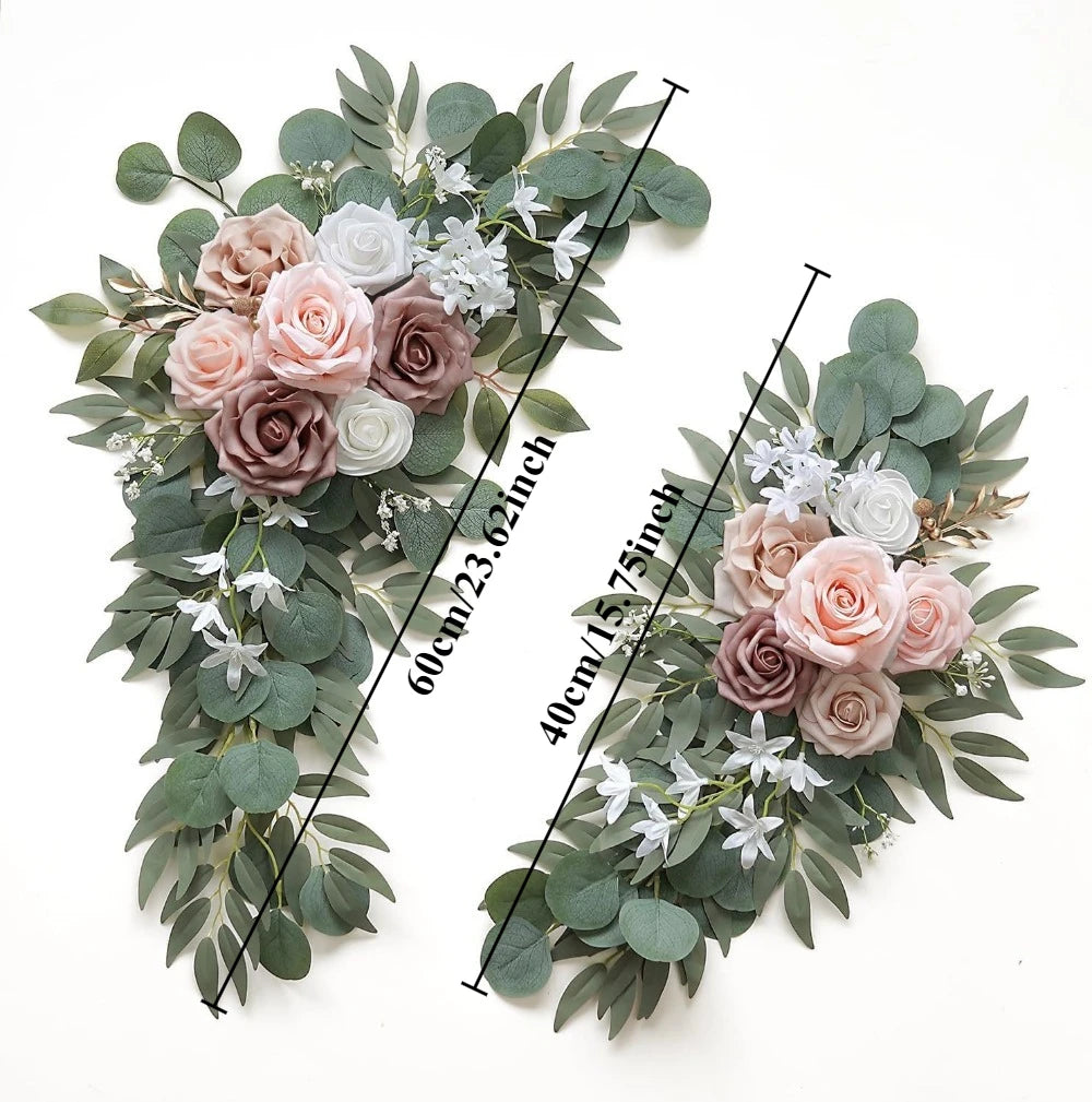 A floral kit featuring dusty rose and white roses and various eucalyptus greenery for a wedding arch.
