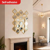 A decorative, gold-framed Moroccan acrylic mirror is mounted on a white wall above a fireplace mantel.