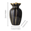 Gold-plated ceramic flower vase with a tapered, fluted shape in black and gold accents