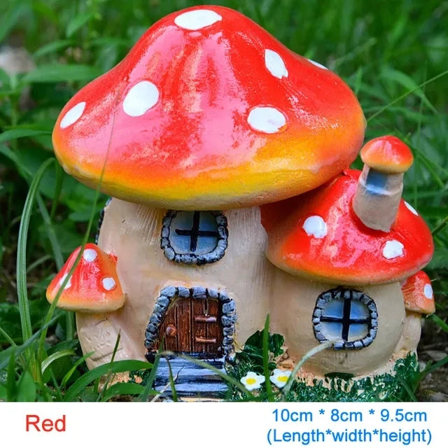 A red resin mushroom house garden statue with white spots and a small wooden door.