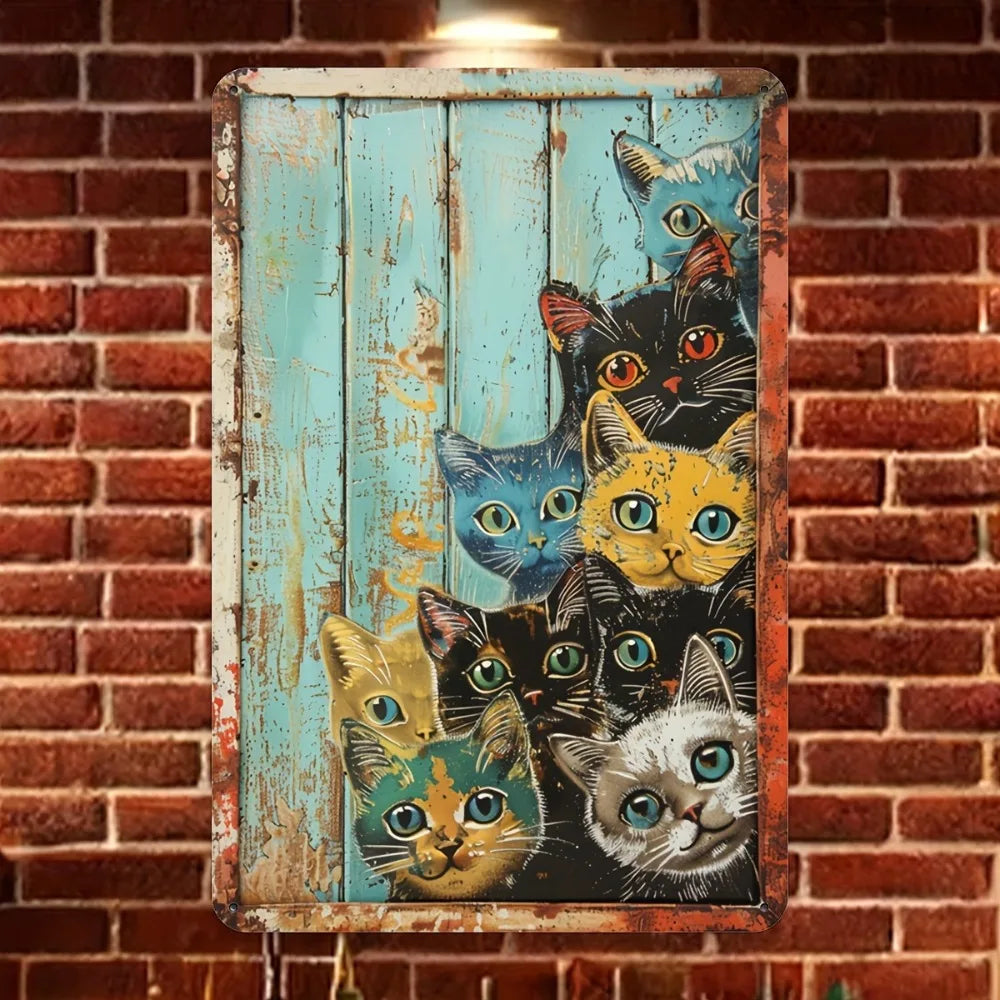 A vertical metal tin sign featuring a collage of various cats in different poses and colors mounted on a brick wall.