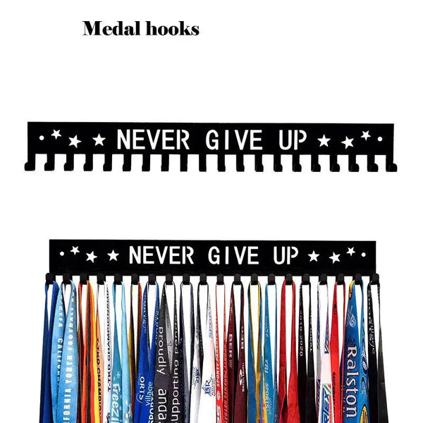 Colgadores de medalla de metal negro que muestran la frase Nunca te rindas