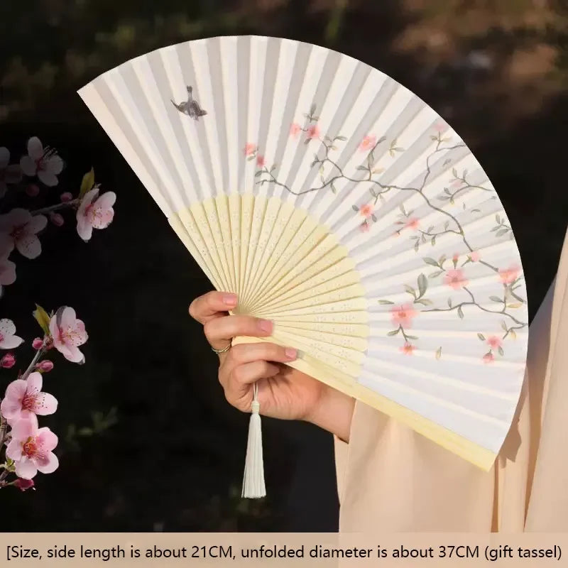 Elegant floral bird print bamboo folding fan with a light beige color and pink accents