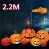 An inflatable orange Halloween pumpkin decoration with a carved face and built-in LED lights.