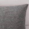 A close-up of a textured gray linen pillowcase.