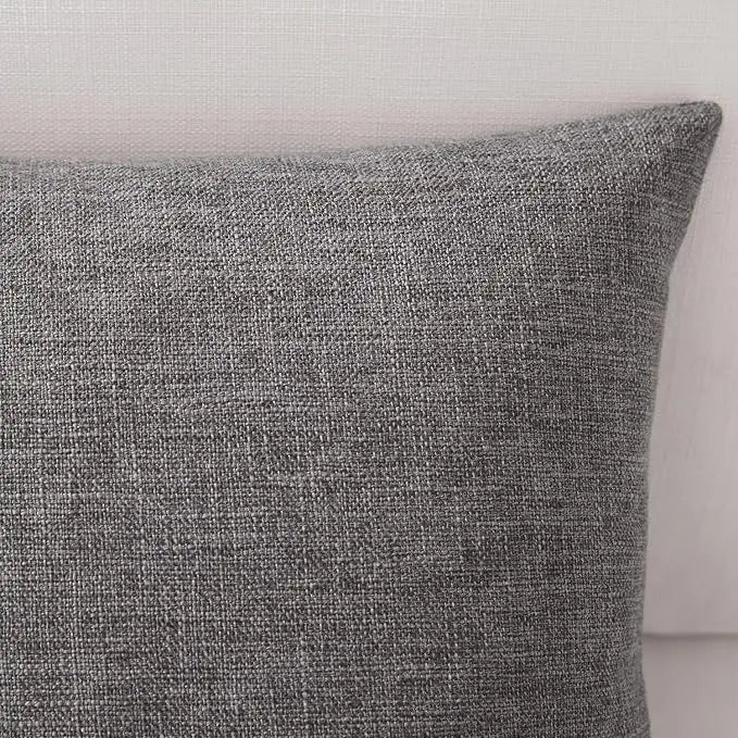 A close-up of a textured gray linen pillowcase.
