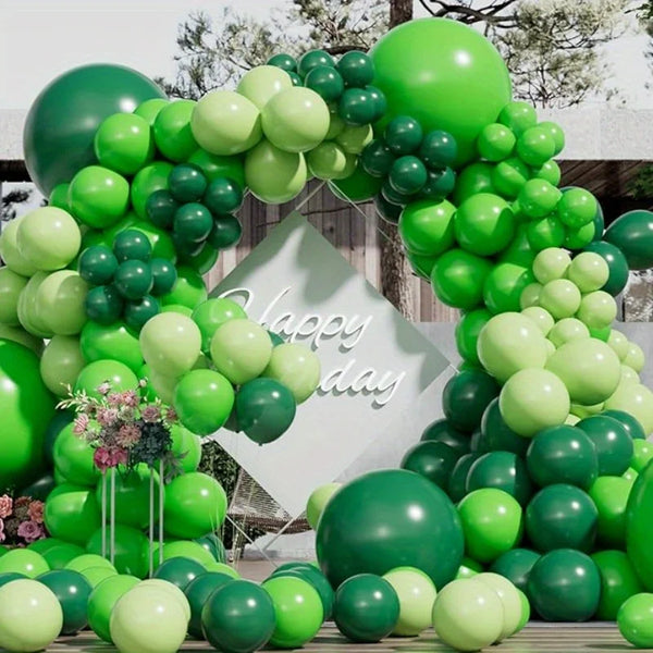 A lush green balloon garland arch kit featuring various shades of green balloons for parties and events.
