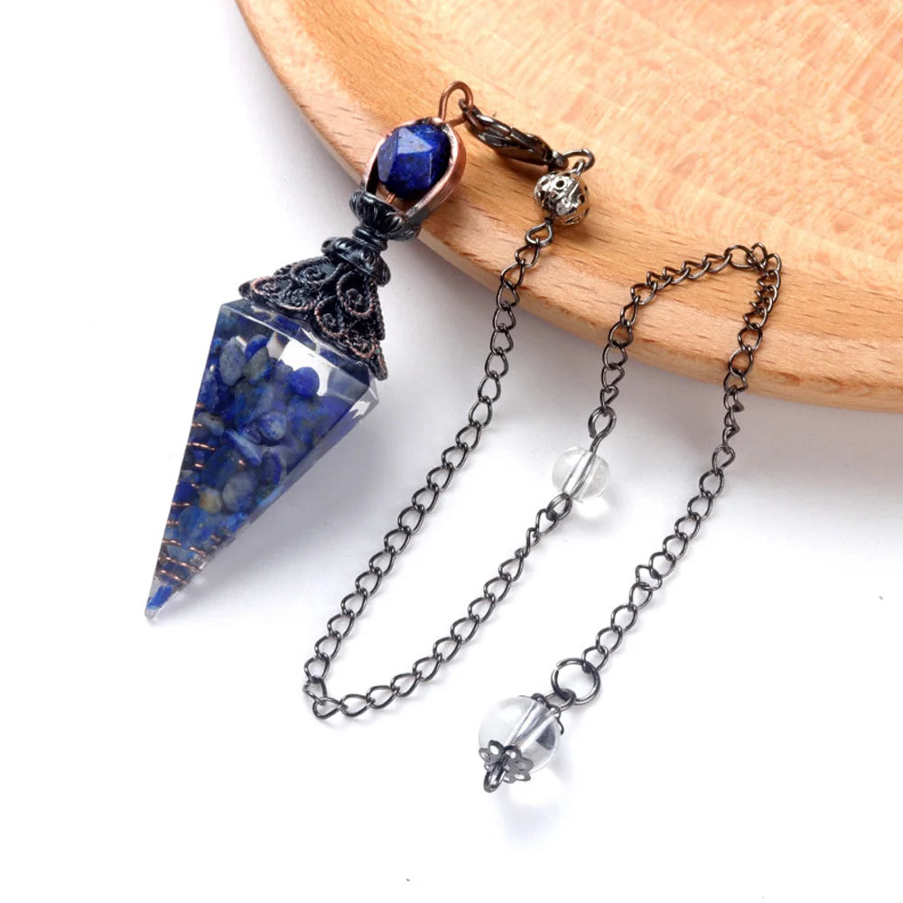 A natural crystal pendulum necklace set featuring a deep blue faceted crystal pendant on a silver chain.