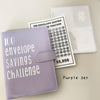 A purple 100 envelope savings challenge binder with a tracker card and numbered pockets.