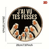 A circular wooden sign featuring multiple painted ducks with the text J'ai vu tes fesses