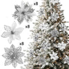 A close-up view of glittered artificial white flowers and snowflakes used as Christmas tree decorations.