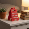 A red 3D printed letter sign ornament shaped like a house that reads a little sign to say I love you