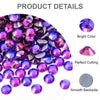 A close-up view of various colored glass rhinestones, including purple and pink, showing bright color, perfect cutting, and a
