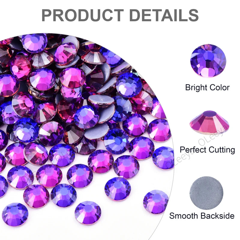 A close-up view of various colored glass rhinestones, including purple and pink, showing bright color, perfect cutting, and a
