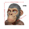 A realistic chimpanzee latex mask with gray fur and green eyes, shown against a white background.